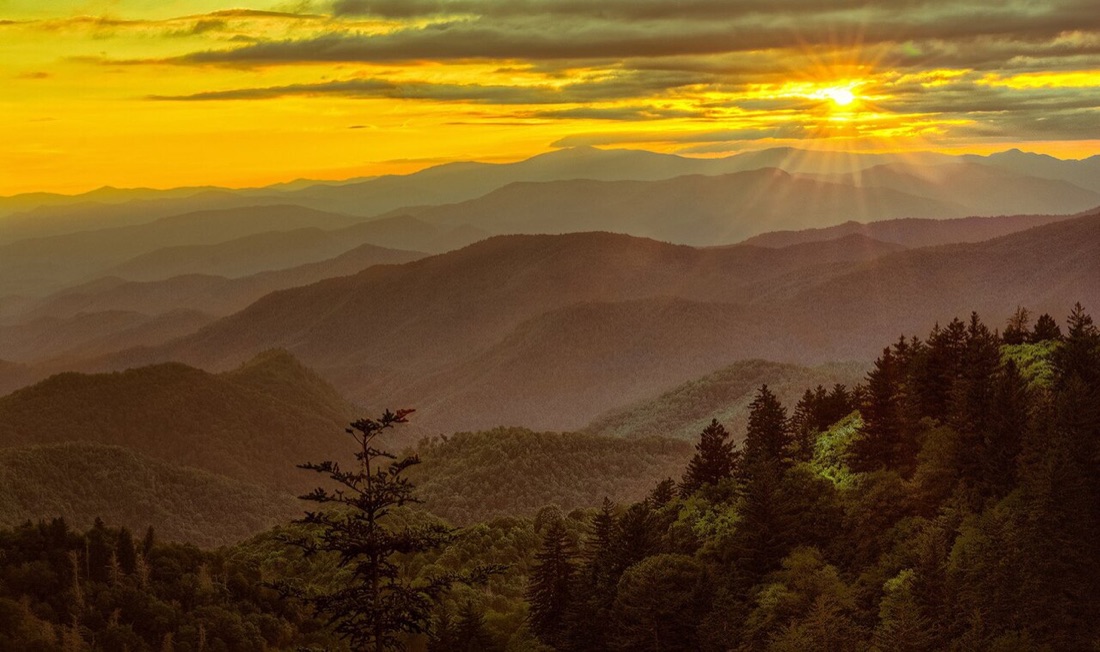 Golden sunset over the layered ridges along the Blue Ridge Parkway, North Carolina